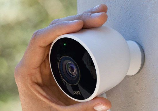 Smart Home Security Cam In Man's Hand