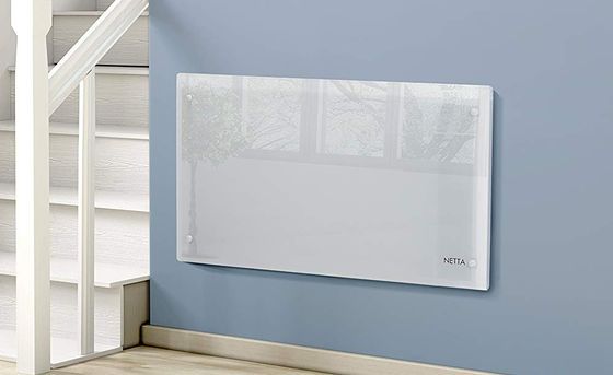 Wide Glass Panel Heater On Painted Wall