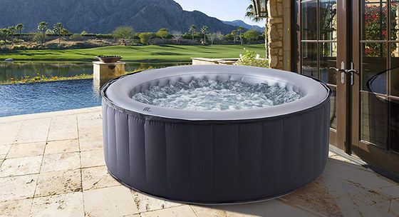 Round Hot Tub On Patio With Bubbling Water