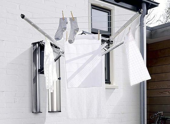 Patio Area Pull Out Washing Line Fixed On White Wall