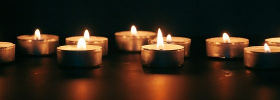 Candles Illuminating In Dark Region