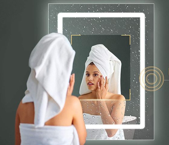 White LED Bath Mirror With Woman Putting Makeup On