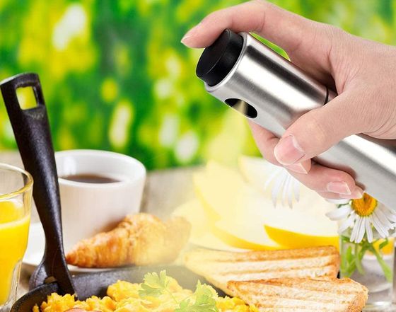 Aerosol Style Oil Spray For Cooking In Man's Hand
