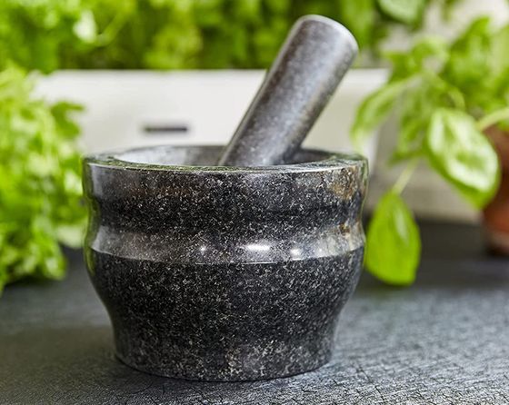 A Small Pestle And Mortar In Black