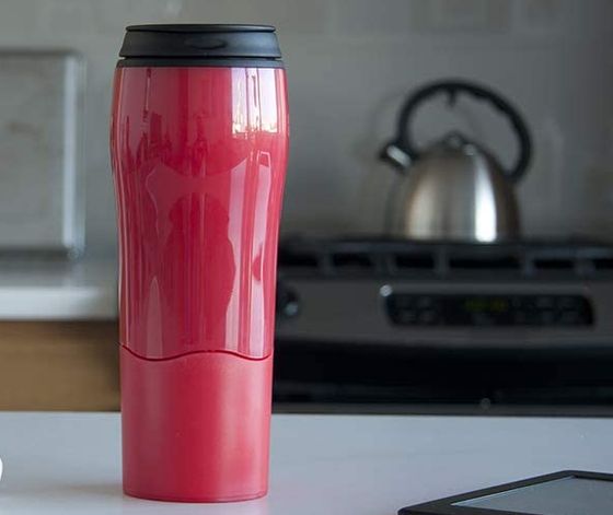 Red Coffee Travelling Mug With A Black Top