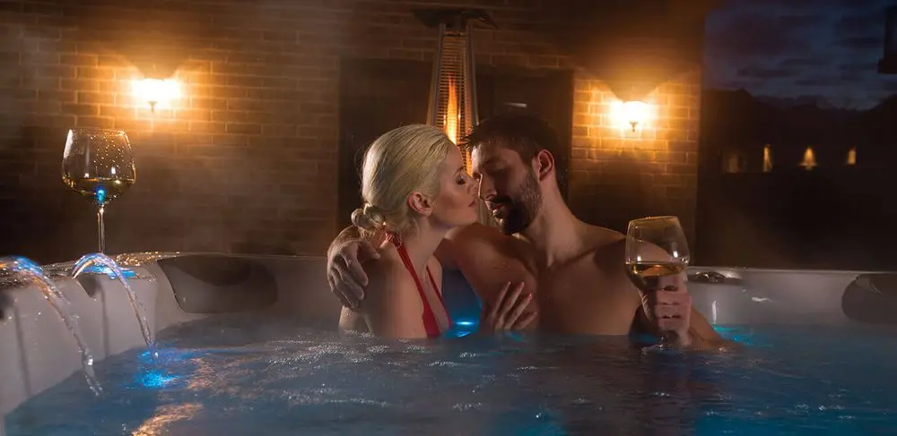 Outdoor Hot Tub Couple Drinking