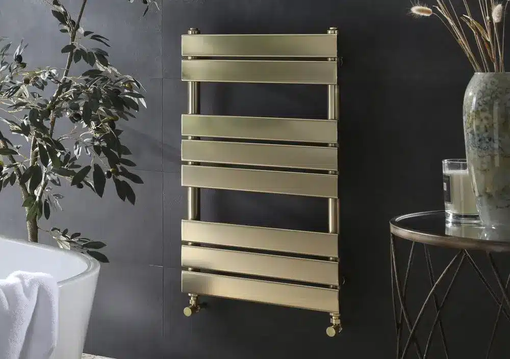 Gold Electric Towel Rail On Black Wall