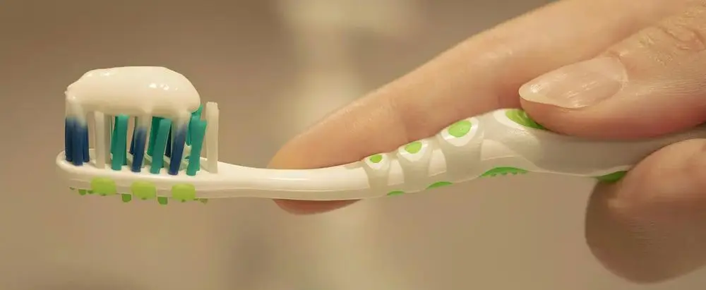 Toothpaste Dispenser With Brush