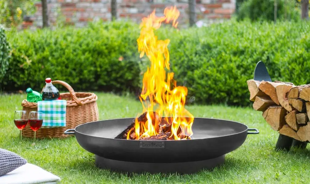 Fire Pit With Logs On Lawn