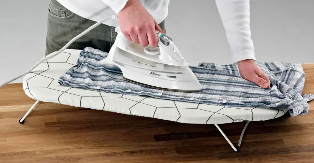 Flat Table Top Ironing Board On Wooden Table