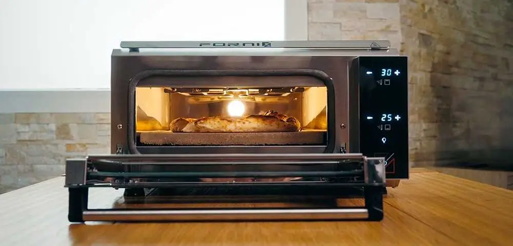 Countertop Pizza Maker Machine On Wooden Table