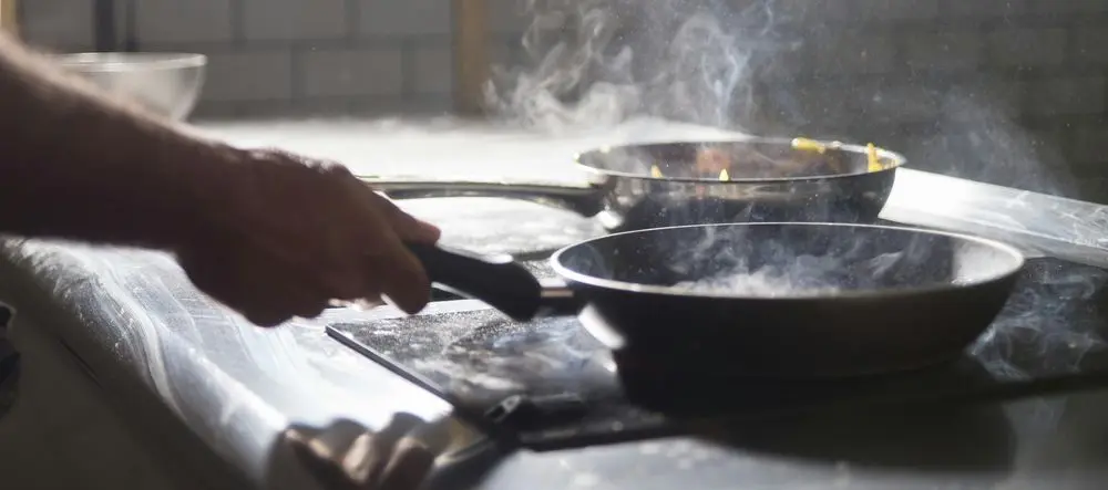 Enamel Coated Cast Iron Frying Pan In Kitchen