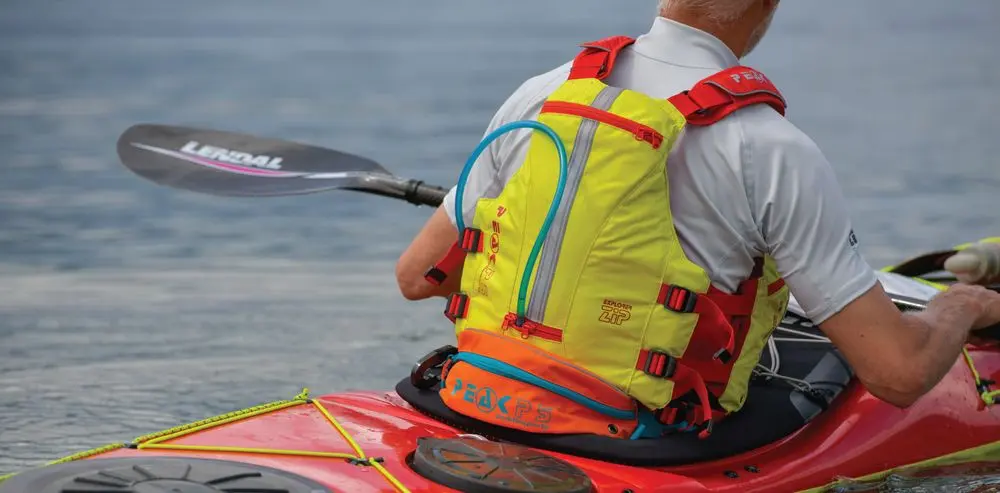Kayak Flotation Vest Worn By Man