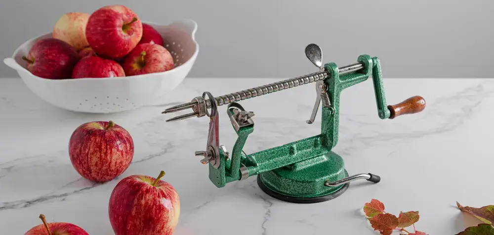 Apple Peeler Machine On Marble Surface