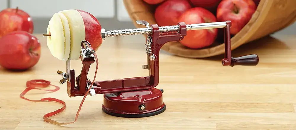 Apple Peeler Corer On Wooden Table
