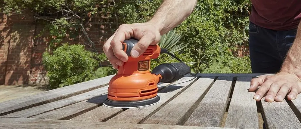 Black & Decker Random Orbit Sander On Wooden Bench