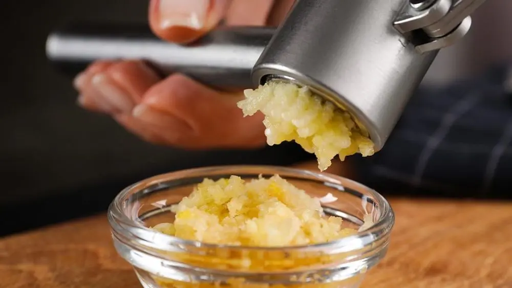 Good Garlic Crusher Over Plate