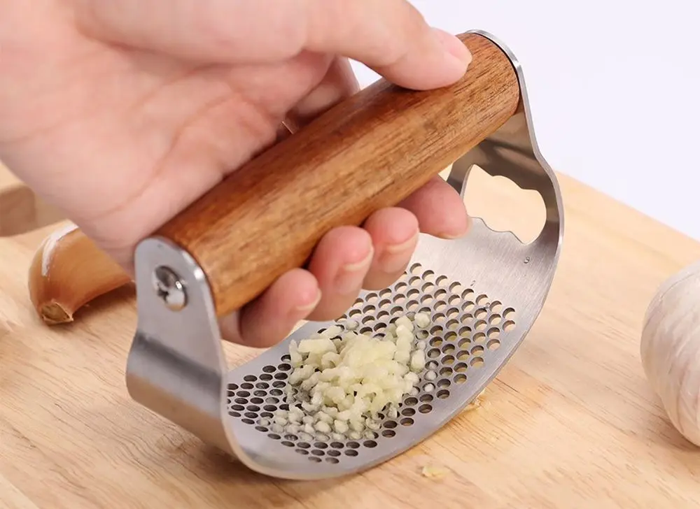 Garlic Press Rocker On Chopping Board