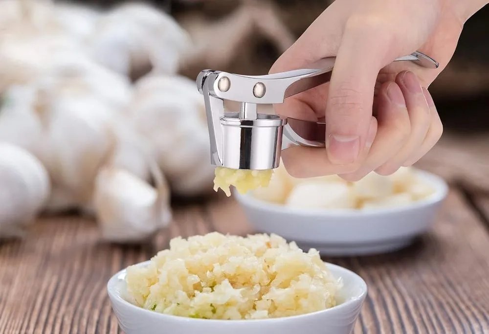 Jsdoin Ergonomic Peeler Garlic Crusher Over Plate