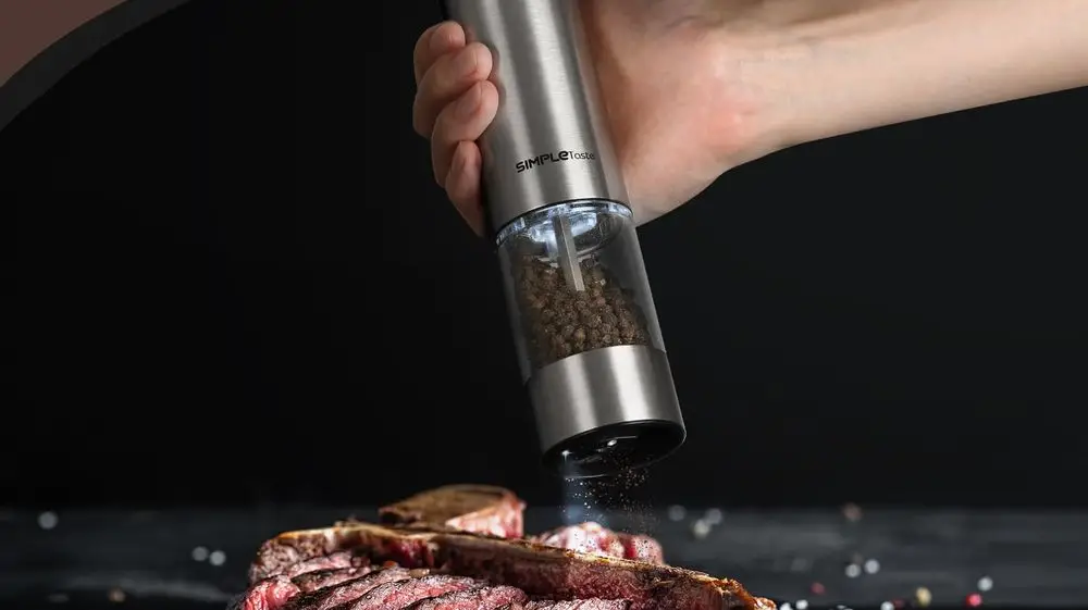 Salt Pepper Battery-Operated Grinder On Steak Meal