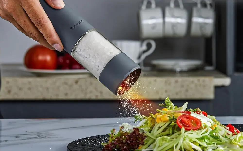 Salt Pepper Battery-Operated Grinder On Summer Salad