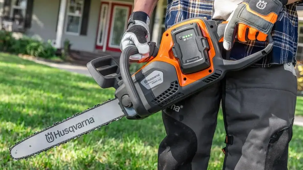 Rechargeable Battery Chainsaw In Garden