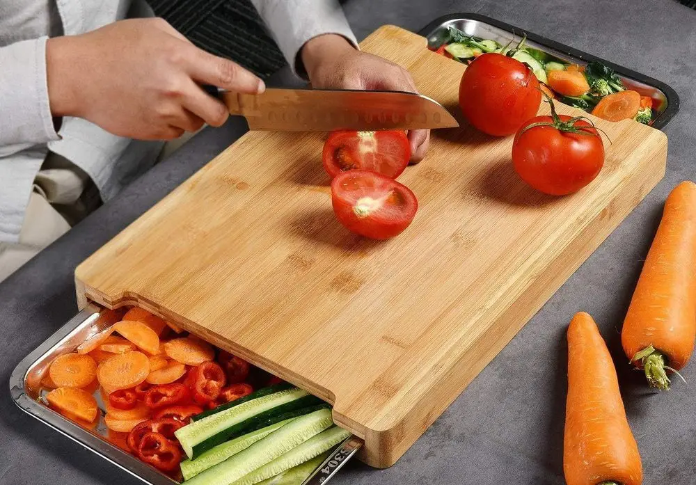 Big Bamboo Cutting Board On Table. Bamboo Chopping Board & Cutting Sets.