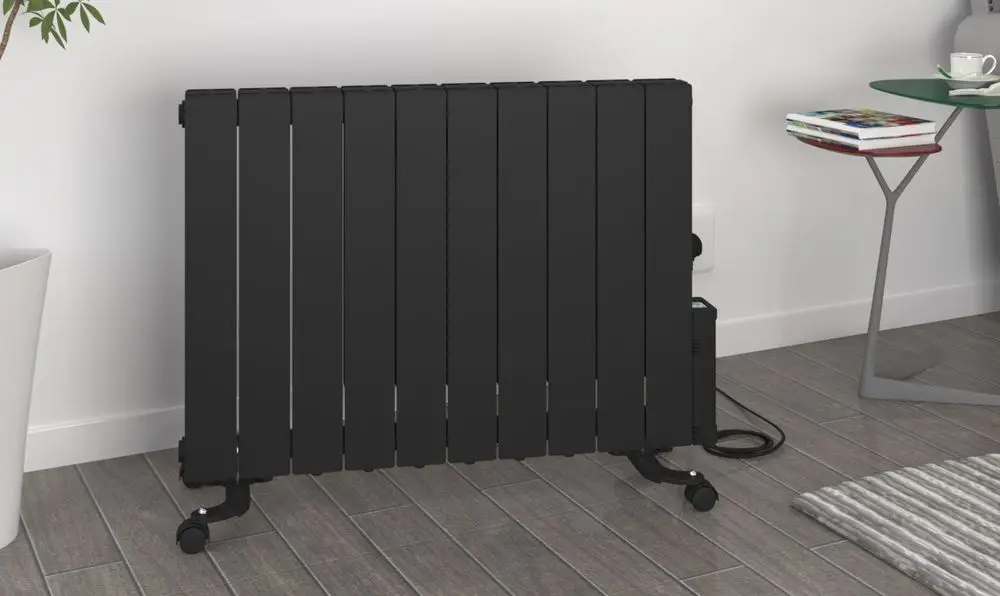 Oil Filled Heater With Thermostat On Wooden Floor