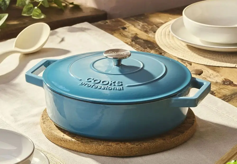 Blue Cast Iron Casserole Dish On Table